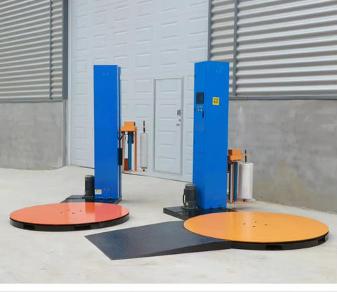 Automatic Stretch Film Pallet Wrapper Heavy Duty Workhorse With 65 Inch Turntable And 4400 Pound Capacity in warehouse setting