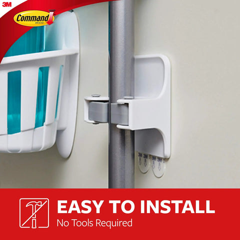 Smooth Broom And Mop Gripper Organizer with adhesive strips on wall holding a pole, damage-free and easy installation.