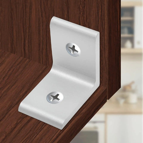 A silver 10 Pack Inside Corner Brackets For 2020 Aluminum Extrusion, 2 Hole L Shape Connectors mounted on wood, showing rust resistance and durability.