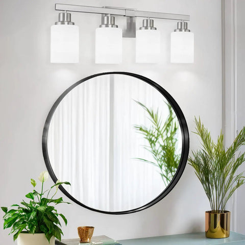 4-Light Nickel Modern Bathroom Vanity Light Fixture With Milky White Glass Shades installed above round mirror in living area