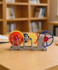 Colorful gears of a 3D Printed Tourbillon Escapement Clock Model with Manual Assembly And Wind Up Movement on desk