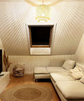 Cozy attic living room with Dope Boho Plug In Pendant Light With Macrame Shade, casting warm light over white sofa and decor.