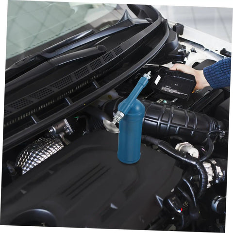 Portable 80cc Grease Gun With Precision Nozzle For Excavators, Cars, And Industrial Equipment in use on a car engine