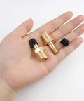 Two Pack One Quarter Inch NPT Tank Valve To Standard Schrader Brass Valve Adapter resting on hand, with caps and Teflon tape