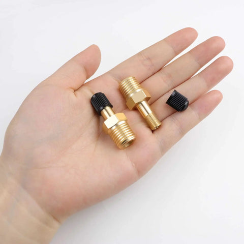 Two Pack One Quarter Inch NPT Tank Valve To Standard Schrader Brass Valve Adapter resting on hand, with caps and Teflon tape