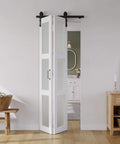 Space Saving Bifold Barn Door 28 Inch by 84 Inch Frosted Glass With Hardware Kit Included White PVC Surface Installed in Living Room