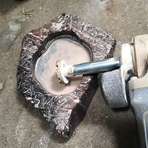 Angle grinder using Five Eighth Inch 11 Thread Angle Grinder Extension Shaft Kit With 75mm Rod on stone surface.