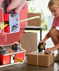 Pallet Strapping Tool With Thickened Ergonomic Handle And Easy Grip Belt Opener used for packaging boxes securely.