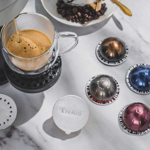 Reusable Aluminum Foil Lids For Nespresso VertuoLine Pods To Reuse Vertuo Coffee Capsules alongside brewed espresso in glass cup