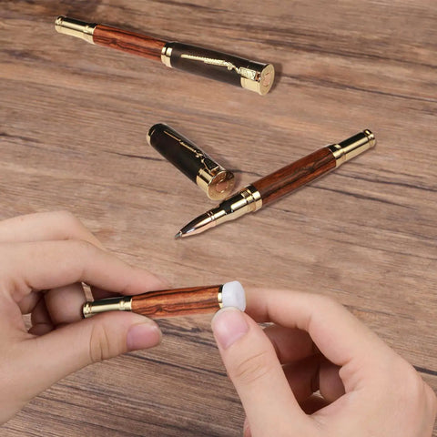 Hands assembling pen with 20 Pack White Nonstick Pen Bushings For CA Finishing And Pen Turning, 0.43 Inch Height, 0.55 Inch Diameter.