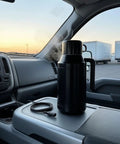 Road Ready Stainless Steel 12V And 24V Car Water Heater Plugs Right Into Cigarette Lighter Portable Electric Kettle on dashboard.