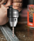 Close-up of a cobalt drill bit in action, drilling metal, part of the Cobalt Drill Bit Set 29 Piece Pro Grade M35 High Speed Steel.