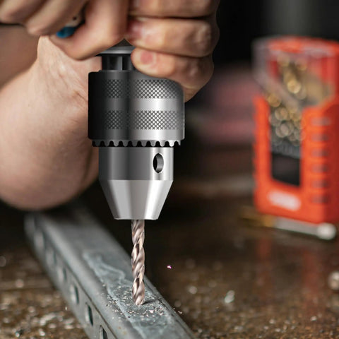 Close-up of a cobalt drill bit in action, drilling metal, part of the Cobalt Drill Bit Set 29 Piece Pro Grade M35 High Speed Steel.