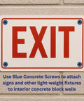 One Quarter Inch By Six Inch Hex Head Concrete Screw Anchor With Drill Bit holding exit sign on brick wall