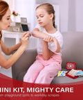 Mother applying bandage from Grab And Go Pocket First Aid Kit With A Compact Hard Shell Case And 50 Essentials Per Pack For A Total Of 600 Medical Items In 12 Packs
