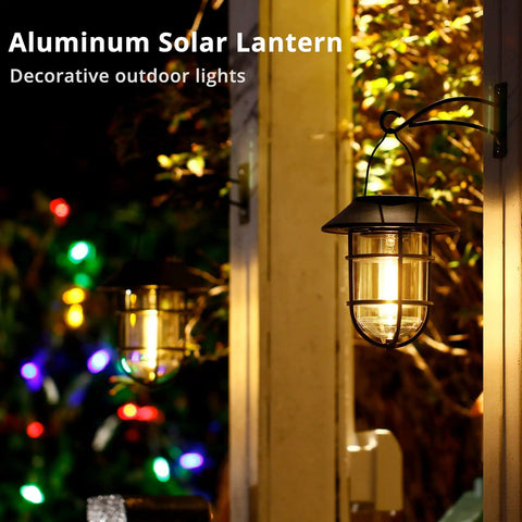 All Weather Metal Solar Lantern Lights With Easy Install Hooks for outdoor use, glowing on a porch with decorative lighting