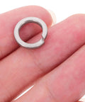 100 Pcs M8 Stainless Steel Split Ring Lock Washers Kit For Bolts And Machinery Fastening Applications Heavy Duty Spring Metal Washers For Auto DIY Projects Tools And Equipment, shown in hand