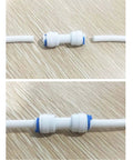 Five Pack One Quarter Inch Quick Connect Pipe Fittings For Reverse Osmosis Systems Equal Straight Plastic Water Line Connectors Easy Install No Tools Needed Durable High Quality RO Fittings shown connected on a wooden background.