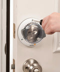 Person installing Kid Proof Deadbolt Lock With Secure Mount No Drilling Or Adhesives Fits Most Deadbolts Under Two Inches Wide