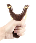 Solid Wood Slingshot With Classic Construction For Adults Heavy Duty Outdoor Catapult Style Toy held by hand, deep brown finish