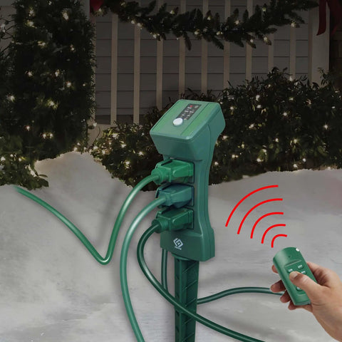 Heavy Duty Outdoor Power Stake With Remote Timer And Photocell Sensor Three Grounded Weatherproof Outlets For Christmas Decorations showing remote control.