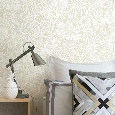 Beige Batik Tropical Leaf Peel And Stick Wallpaper Roll 20 Point 5 Inches Wide By 16 Point 5 Feet in a bedroom setting.
