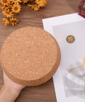 Person holding Giant Diameter Cork Bottle Stopper For Wine Jars And Canning Bottles Top Six Point Three Inch Bottom Five Point Five Inch