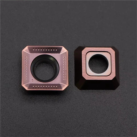 Pro Grade Carbide Inserts For CNC Metal Turning Tools, side view of stainless steel milling inserts on a black background.