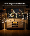 LC30 VU Meter Amplifier And 2 In 2 Out Speaker Switcher With Remote for home theater, shown in a living room audio setup
