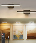 Top Notch Rechargeable Picture Lights Two Pack mounted above art, showcasing warm illumination on frames and remote control.