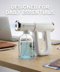 Disinfectant Fogger Machine For Fast Cleanup In Small And Medium Rooms on desk with passports and laptop