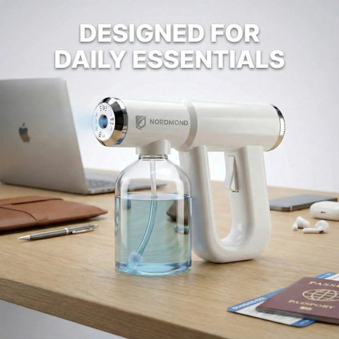 Disinfectant Fogger Machine For Fast Cleanup In Small And Medium Rooms on desk with passports and laptop