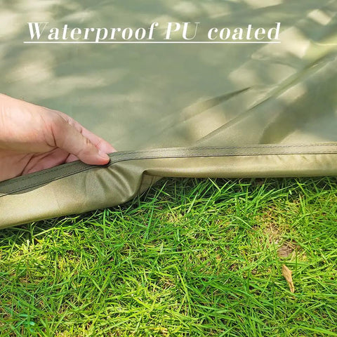 Hand holding edge of Ultralight Waterproof Tent Footprint Ground Sheet For Camping on grass showing waterproof PU coating.