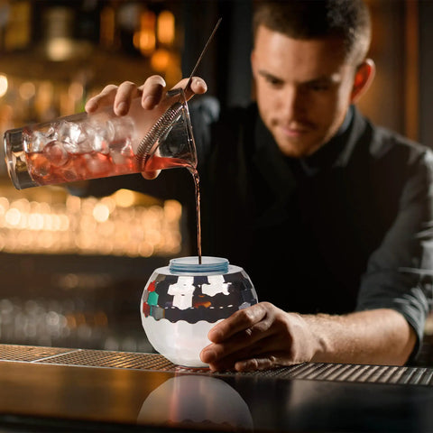Bartender pouring cocktail into a Disco Ball Cups 4-Pack Reusable Tumblers With Straws For Party Nights at a bar