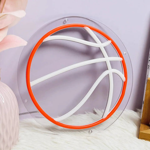 Basketball-shaped neon light on desk, with orange and white LED, round acrylic backplate, decorative room piece