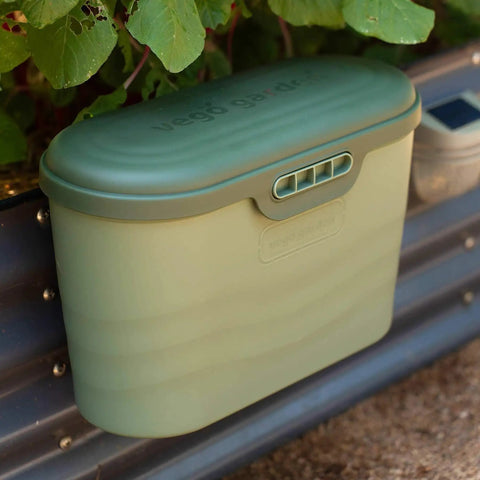 Heavy Duty Garden Tool Box Basil Green With Hinged Lid For Easy Access And Protection, hanging from garden beds in use