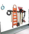15 Piece Garage Tool Storage Rack Wall Mount Organizer Heavy Duty Steel Rack With Broom Holder Hooks And Hangers Holds All Your Garage Gear Rake Shovel Lawn Garden Up To 420 Lbs With Scratch Resistant Rubber Coated Sleeves installed on wall