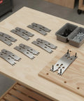 Super Durable Stainless Steel Fastening Plate Clamp For Carpentry And CNC Router Projects on wooden workbench with screws.