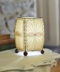 Mini Square Table Light 477 N Natural Finish, 6x6x8 inch lamp, on white nightstand with decorative leaves, 13W spiral CFL
