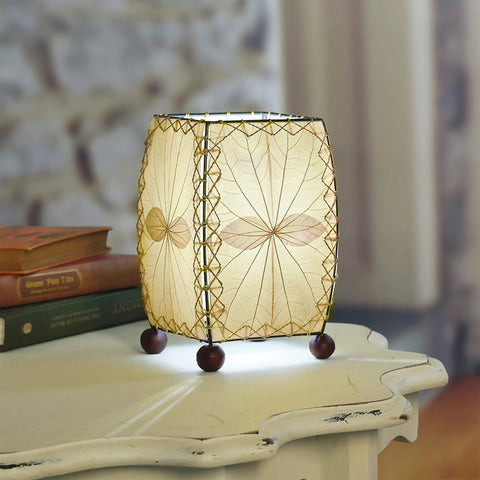 Mini Square Table Light 477 N Natural Finish, 6x6x8 inch lamp, on white nightstand with decorative leaves, 13W spiral CFL