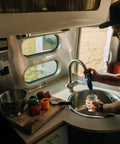 Person using Tap Water Filtration System With 0.1 Micron Inline Filter, Fits Faucets And Hose Bibs, Keeps Camp Water Fresh