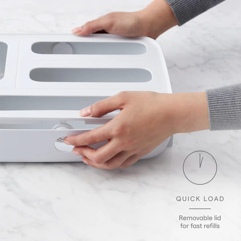Hands opening StoraBag Drawer Food Bags Dispenser For Kitchen Storage 4 Slot Plastic Sandwich Bag Organizer with removable lid.