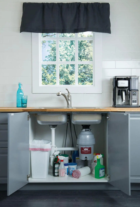 Kitchen sink with Ultra Fast Kitchen Garbage Disposal with Power Cord for No Fuss Install visible under the sink.