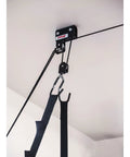 Easy Garage Storage Hoist For Kayaks Canoes Bikes And Ladders One Person Lift System With Pulleys Hooks Brackets Hardware 50 Ft Rope Saddle Straps 120 Lb Capacity Black ceiling pulley and strap close-up