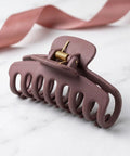 8 Pack Hair Clip Spring Replacement with strong clamping steel jaw clips on marble surface