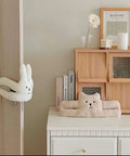 Cute Door Pinch Guard For Kids Soft PP Cotton Door Stopper That Prevents Pinches And Slams shown on wooden door