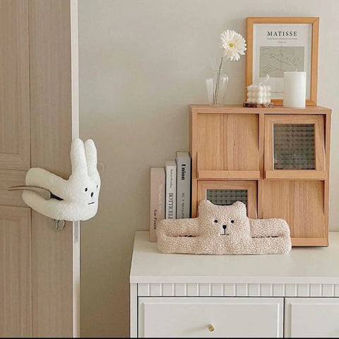 Cute Door Pinch Guard For Kids Soft PP Cotton Door Stopper That Prevents Pinches And Slams shown on wooden door