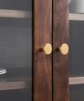 Heavy Duty Round Cabinet Knobs Four Pack Brushed Gold Zinc Alloy kitchen handle replacement on wooden cabinet doors.