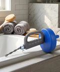 Heavy Duty 33 Foot Manual Drain Snake Featuring Flexible Spring Steel Wire That Busts Gnarly Clogs And Main Line Blockages While Gliding Smoothly Through Every Pipe Bend resting on a bath edge.