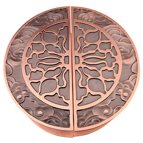 Bronze circular decorative drain cover with intricate cloud and wave patterns